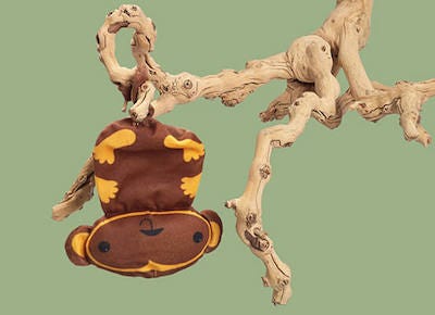 brown and yellow monkey krinkle cat toy hanging upside down