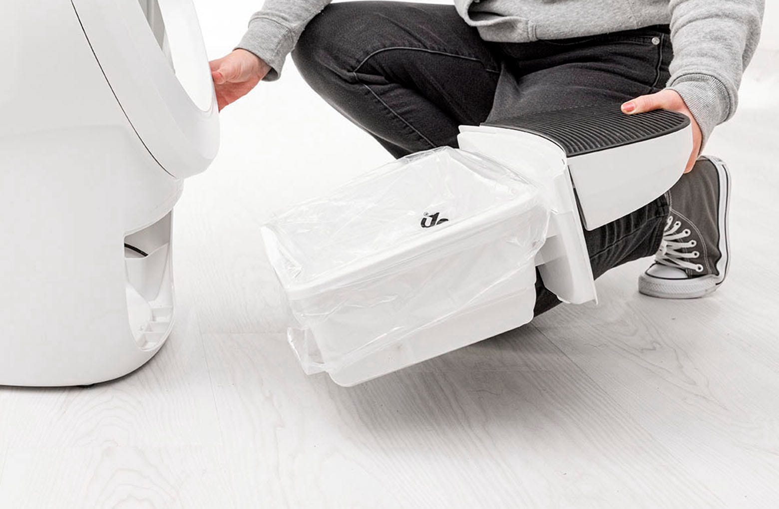 Image of removing the waste drawer from the Litter-Robot 4.