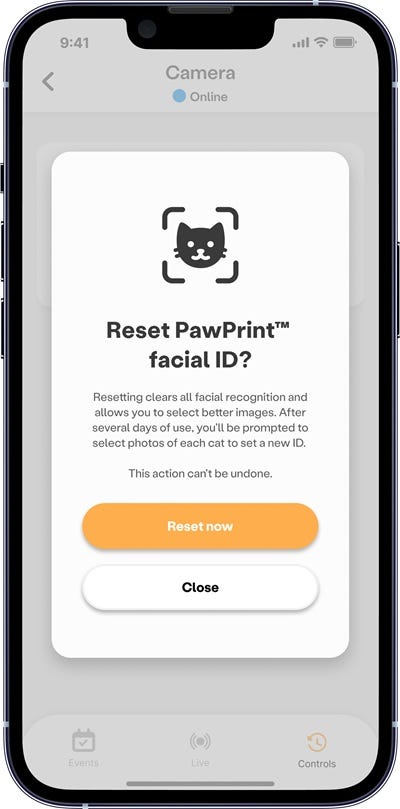 Whisker app confirmation screen for resetting PawPrint facial ID with Reset now and Close options