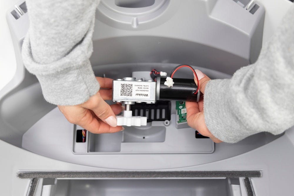 Holding disconnected motor above motor cavity