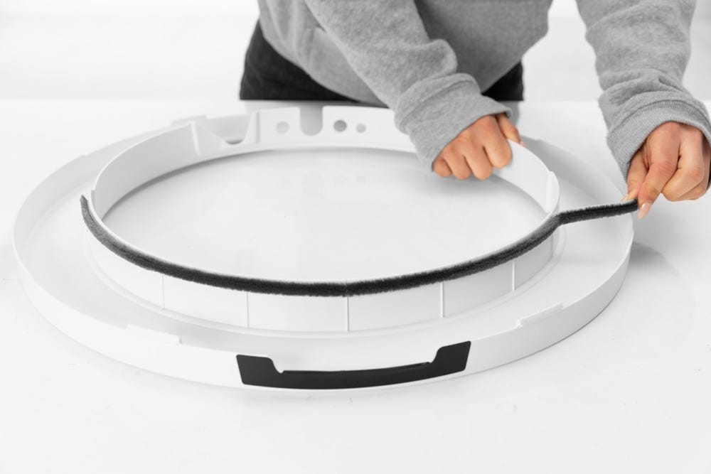 Bezel seal strip being removed