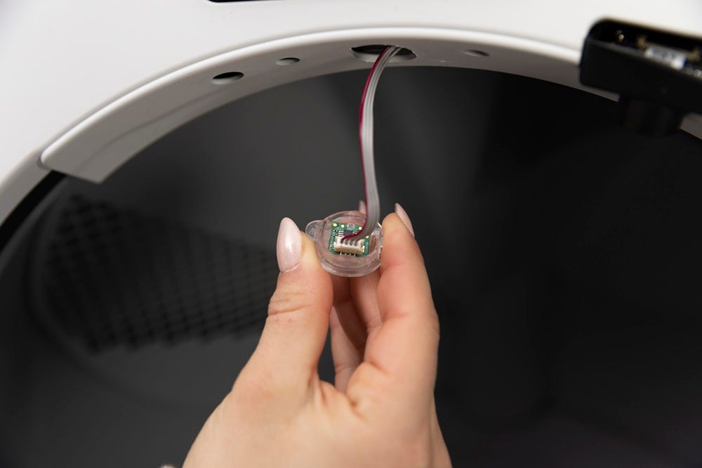 Sensor connected to wires with wires hanging down from bezel