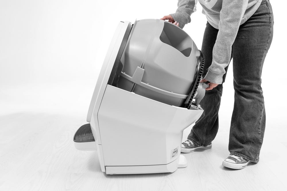 Removing Litter-Robot globe back into base while holding key