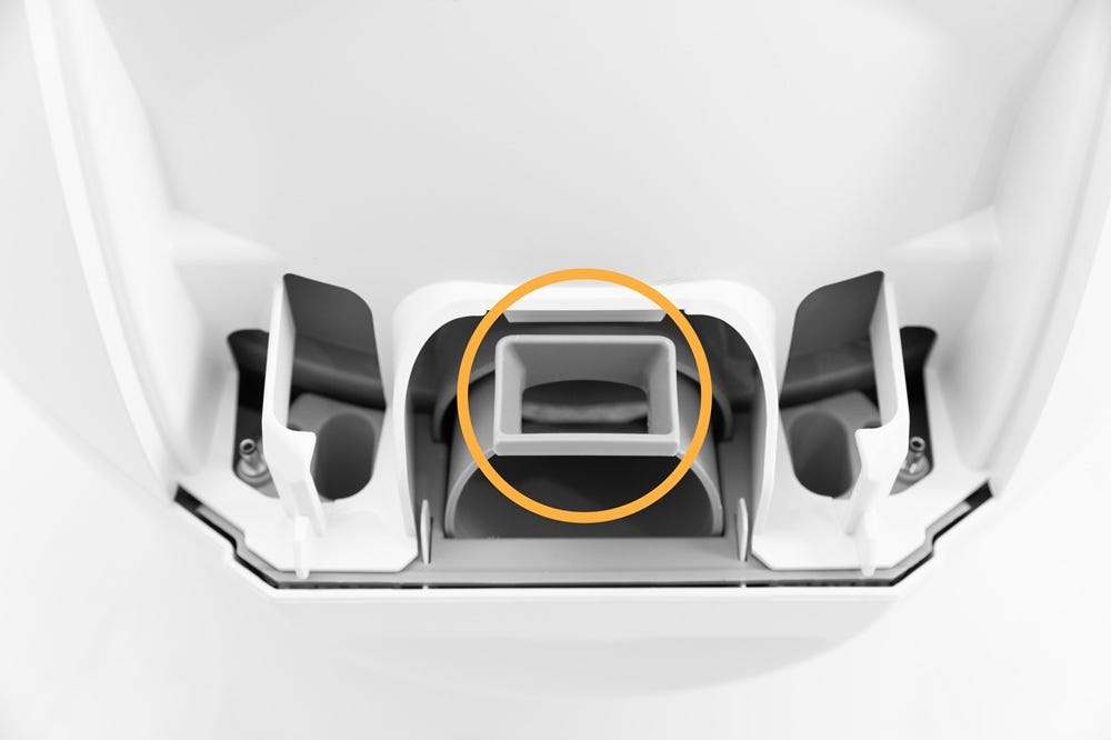 Litter-Robot base hing area with bonnet plate removed and circle around key