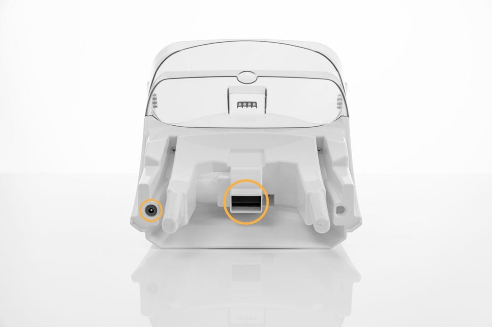Bottom of LitterHopper with metal prong and dispensing area circled