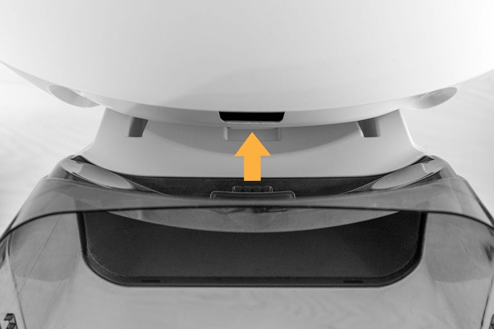 LitterHopper mounting tab with an arrow pointing towards slot in Litter-Robot