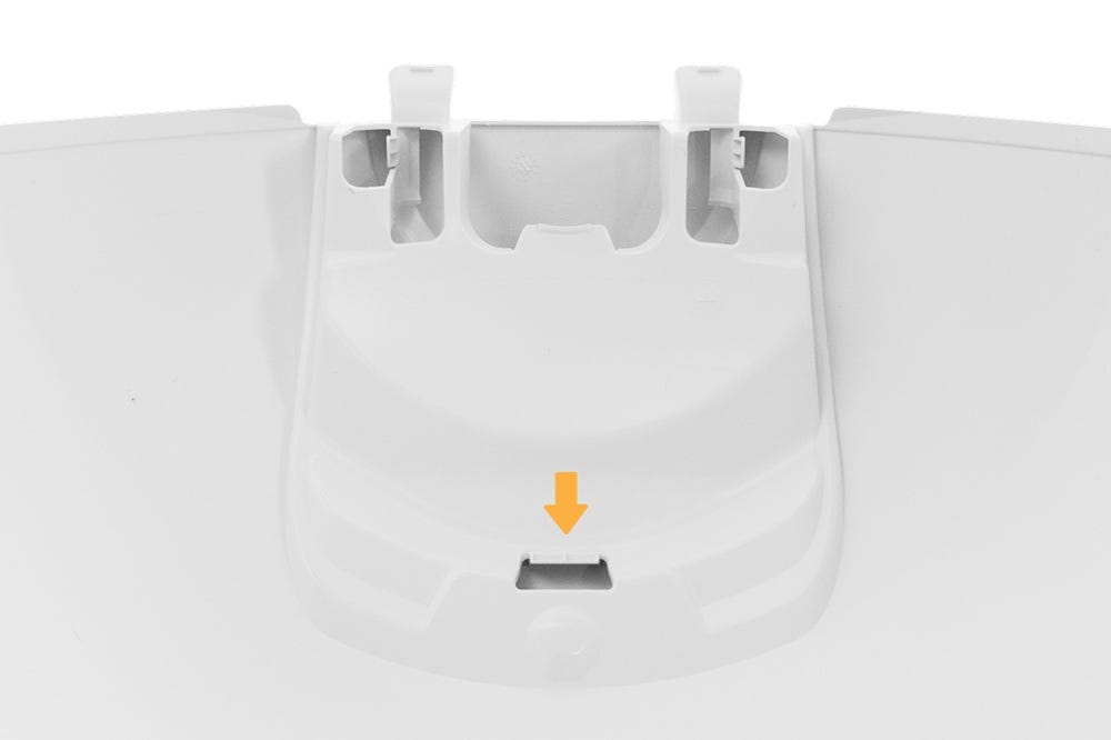 Litter-Robot closeup of plate with arrow pointing to bottom tab and slot