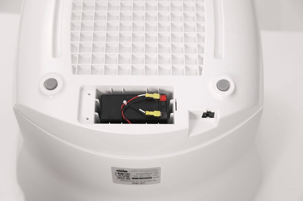Battery inside of base cavity