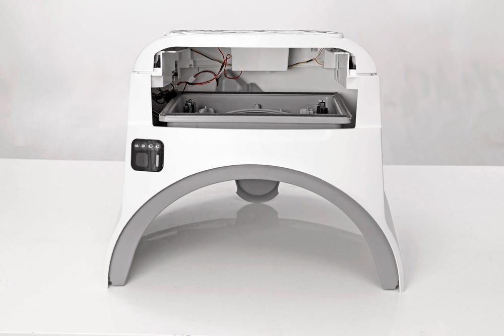 Litter-Robot base upside down with drawer removed